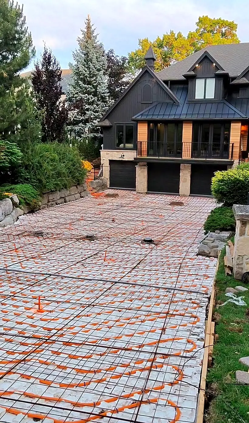 Snowmelt heating loops covering a full driveway in front of a large home