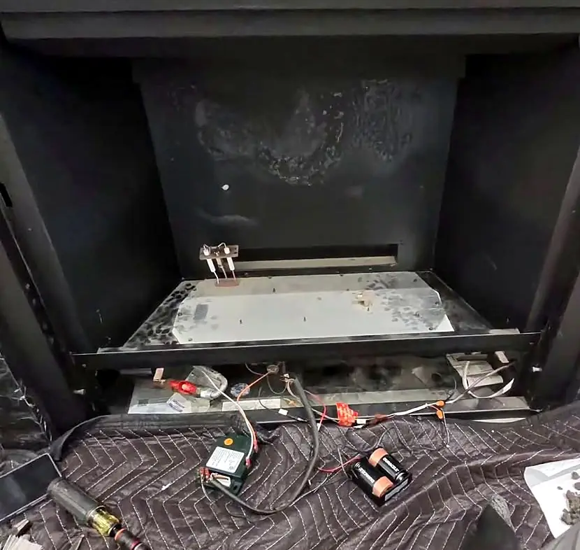 The same fireplace stripped down before the rebuild